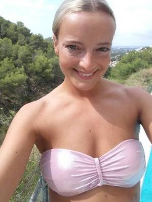 Blonde amateur Victoria takes a series of nude and non nude selfies on amateurlikes.com