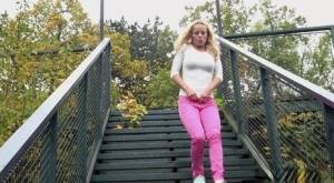 Blonde Victoria Pure pulling down her tight pants to pee on the bleachers on amateurlikes.com