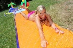 Young blonde Ally Kay ends a water fight by having sex in backyard on amateurlikes.com