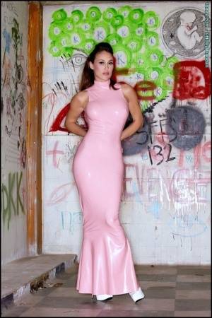 Latina beauty Ryan Keely inserts a vibrator after removing a long latex dress on amateurlikes.com