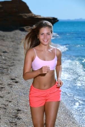 Fit young girl Mary Rock gets completely naked on a beach after exercising on amateurlikes.com