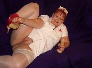 Mature redheaded nurse Valgasmic Exposed exposes herself during dildo play on amateurlikes.com