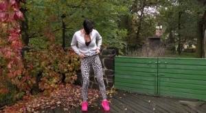 Short haired female Gabriellla Gucci squats for a pee on a deck on amateurlikes.com