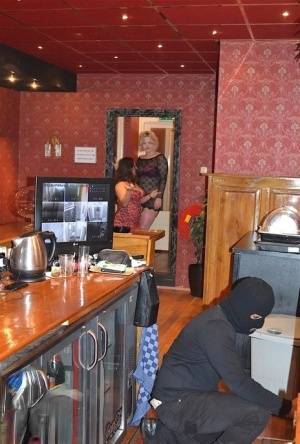 Amateur chick Kimberly Scott and a girlfriend disrobe a hooded male robber on amateurlikes.com