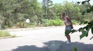 Blonde female Nikki Dream can't hold her pee any longer and squats on roadway on amateurlikes.com